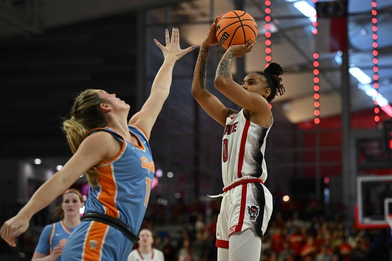 NC State guard attempts shot over Tennessee defender