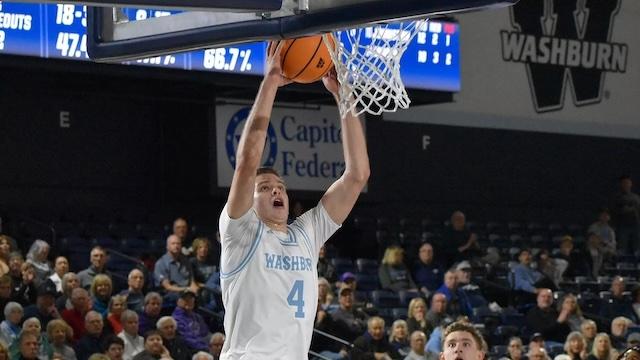 Dillon Claussen dunks it for Washburn basketball. 