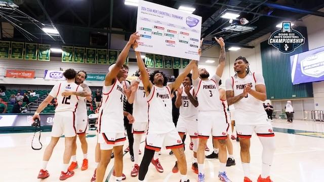Cal State East Bay hoists its first-ever CCAA title banner. 