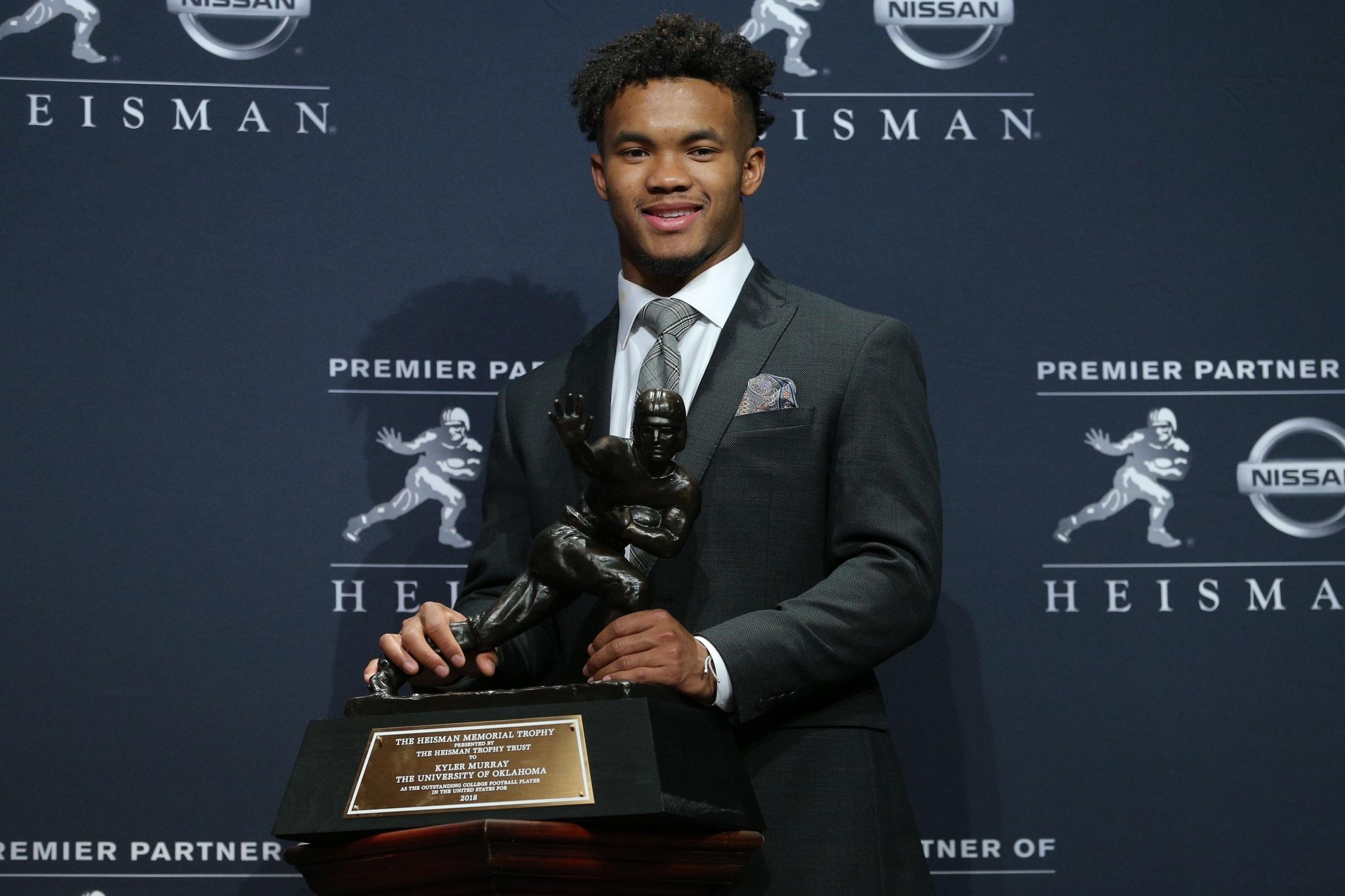 Kyler Murray posing with his Heisman Trophy after the 2018 award ceremony.