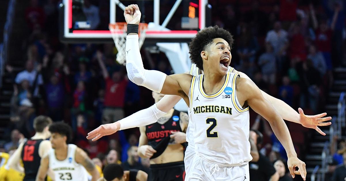 Michigan's Jordan Poole celebrates his buzzer-beater over Houston.