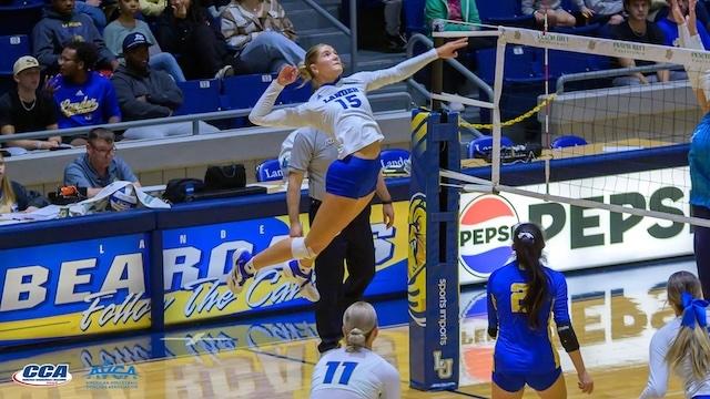 Katie Miller of Lander goes up for a kill.