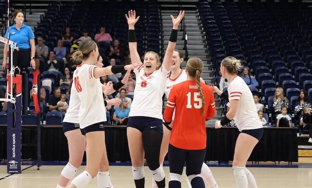 Annika Helf (middle) and MSU Denver cheer on another win. 