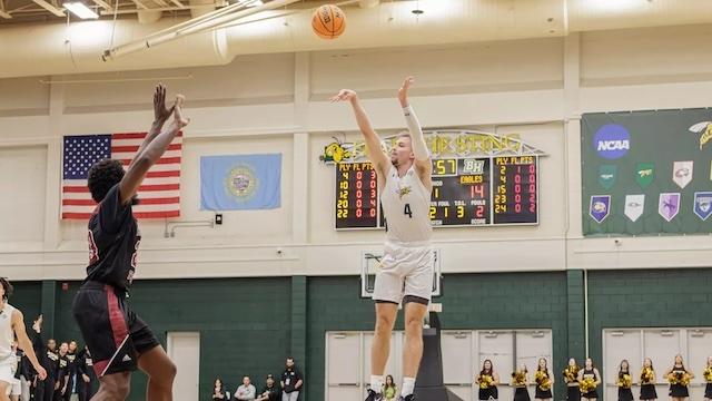 Tristan Hurdle fires a 3-pointer in DII men's basketball. 